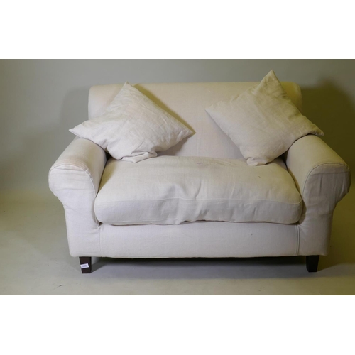 1096 - A Habitat two seater sofa with cream coloured linen covers, 140cm wide AF seat stained