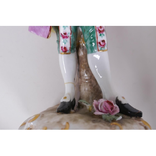 110 - A C19th continental hard paste porcelain figure of a flower seller, 22cm high, another of a Dandy an... 