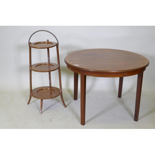 1101 - A Victorian inlaid mahogany occasional table, together with a walnut three tier folding cake stand, ... 