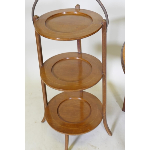 1101 - A Victorian inlaid mahogany occasional table, together with a walnut three tier folding cake stand, ... 