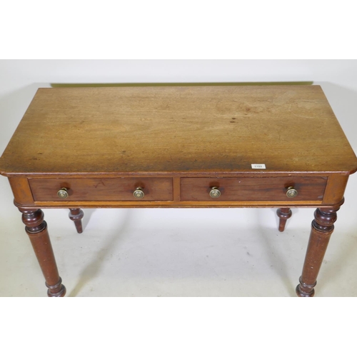 1102 - An early C19th mahogany writing table with two drawers, raised on tapering turned supports, 107 x 52... 