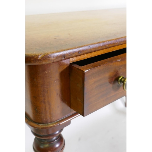 1102 - An early C19th mahogany writing table with two drawers, raised on tapering turned supports, 107 x 52... 