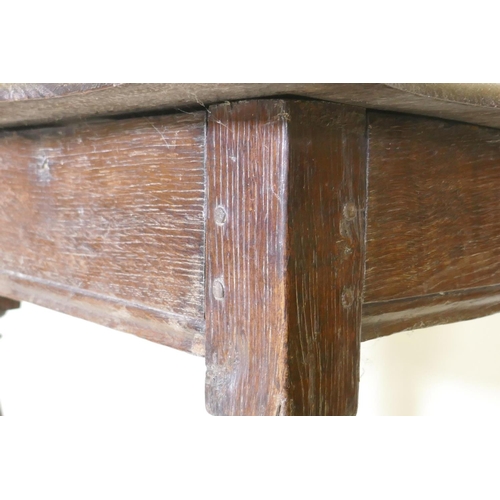 1107 - A late C17th/early C18th oak side table with shaped top and pegged construction, raised on baluster ... 