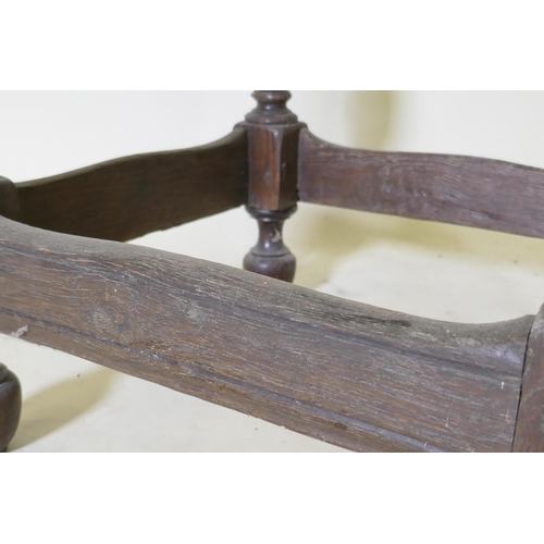 1107 - A late C17th/early C18th oak side table with shaped top and pegged construction, raised on baluster ... 