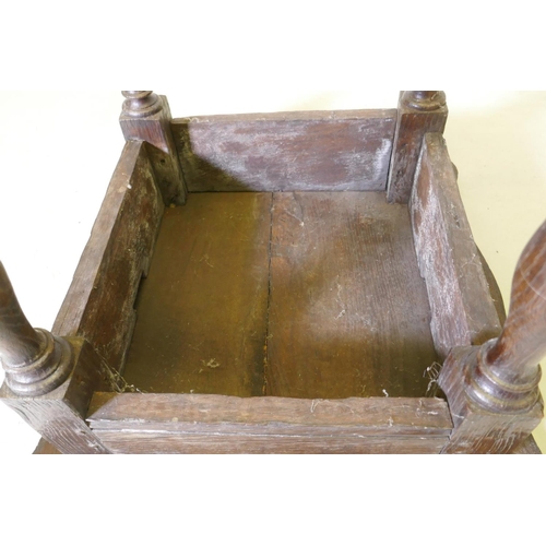 1107 - A late C17th/early C18th oak side table with shaped top and pegged construction, raised on baluster ... 