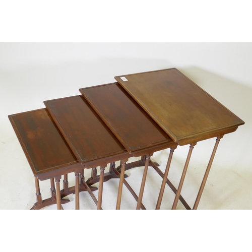 1108 - A quartetto nest of mahogany occasional tables, with beaded tops, raised on slender turned tapering ... 