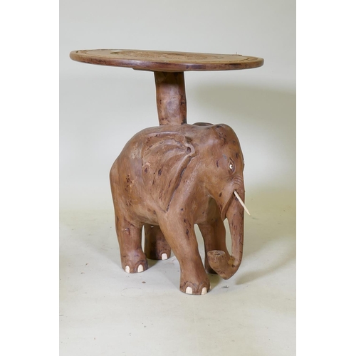 1111 - A carved wood elephant side table, 63cm diameter, 70cm high, top requires re-attaching