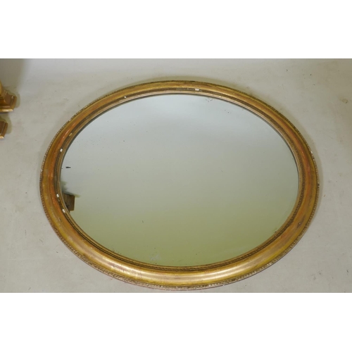 1112 - A gilt framed oval wall mirror, 89cm x 78cm