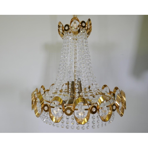 1114 - A 1960s gilt metal Empire inspired chandelier with glass drops, 50cm drop excluding chain