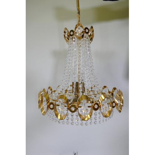 1114 - A 1960s gilt metal Empire inspired chandelier with glass drops, 50cm drop excluding chain