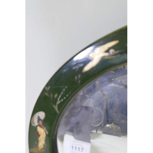 1117 - 1920s green lacquer oval mirror with raised chinoiserie decoration and bevelled glass, 77 x 47cm