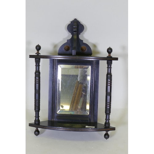 1123 - A Victorian Aesthetic style ebonised hanging corner bracket with parcel gilt decoration and mirror b... 