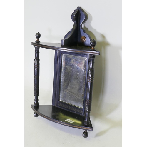 1123 - A Victorian Aesthetic style ebonised hanging corner bracket with parcel gilt decoration and mirror b... 