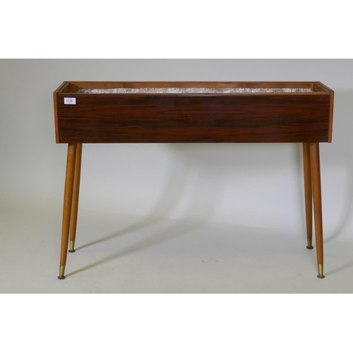 1126 - A mid-century planter with rosewood design, formica sides, pine lined with a metal liner, raised on ... 