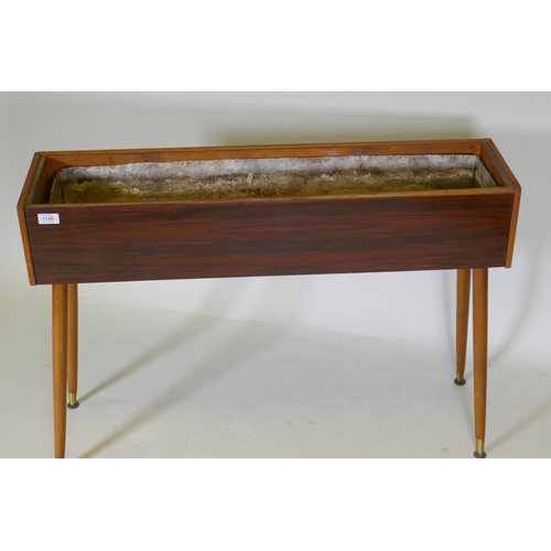 1126 - A mid-century planter with rosewood design, formica sides, pine lined with a metal liner, raised on ... 