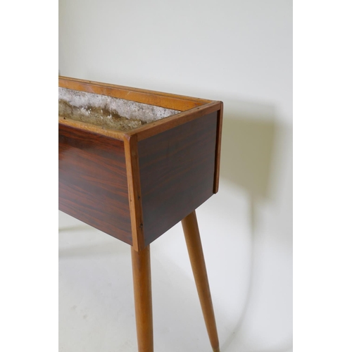 1126 - A mid-century planter with rosewood design, formica sides, pine lined with a metal liner, raised on ... 