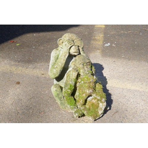 1131 - Three concrete garden monkeys 'hear no, speak no, see no evil', largest 31cm high