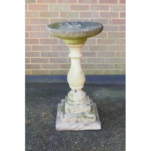 1132 - A reconstituted stone birdbath by Sandford Stone, 88cm high x 47cm diameter