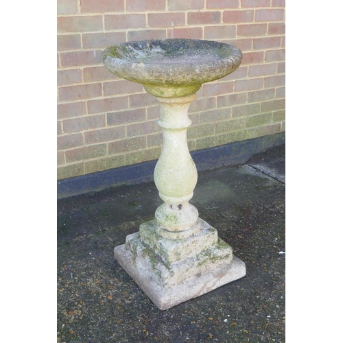 1132 - A reconstituted stone birdbath by Sandford Stone, 88cm high x 47cm diameter