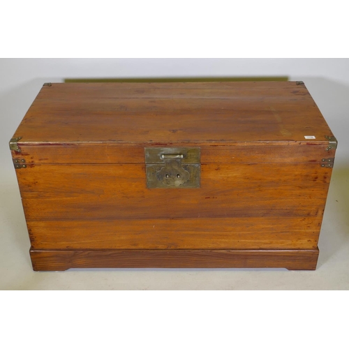 1139 - An oriental hardwood coffer with brass mounts, 126 x 60 x 66cm