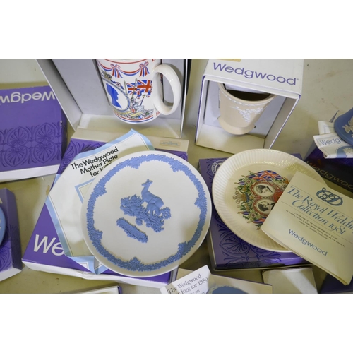 114 - A collection of Wedgwood Jasperware and commemorative ware Easter eggs, plates, tankard etc, with bo... 