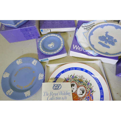 114 - A collection of Wedgwood Jasperware and commemorative ware Easter eggs, plates, tankard etc, with bo... 