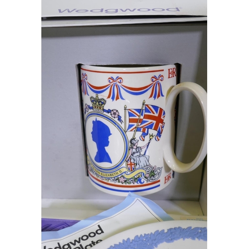 114 - A collection of Wedgwood Jasperware and commemorative ware Easter eggs, plates, tankard etc, with bo... 