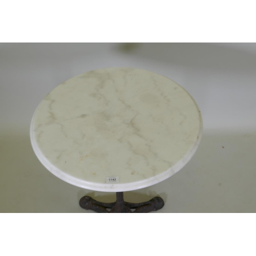 1142 - A marble topped bistro table with a cast iron base, 73cm high x 61cm diameter