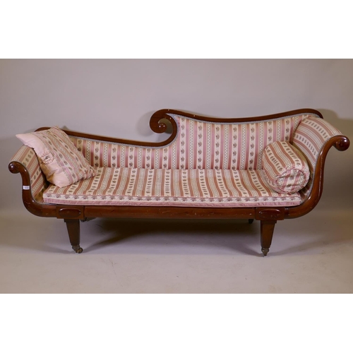 1162 - A C19th walnut chaise longue with scrolled ends, raised on tapering supports with brass castors, 200... 