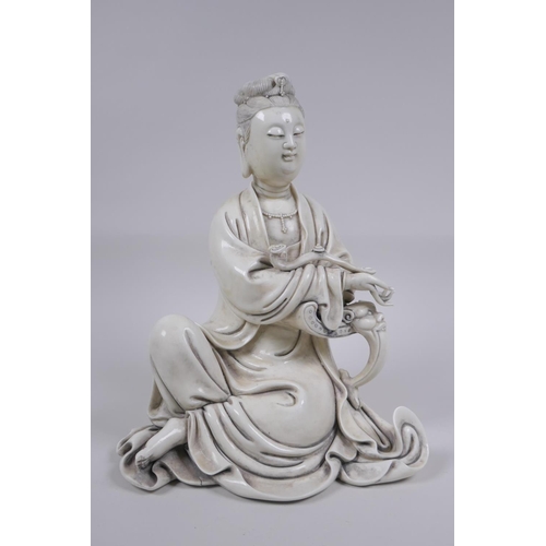 118 - A Chinese blanc de chine porcelain figure of Quan Yin, impressed seal mark to the reverse, 25cm high