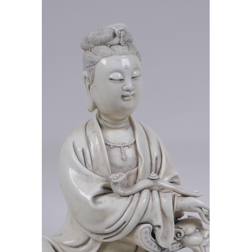 118 - A Chinese blanc de chine porcelain figure of Quan Yin, impressed seal mark to the reverse, 25cm high