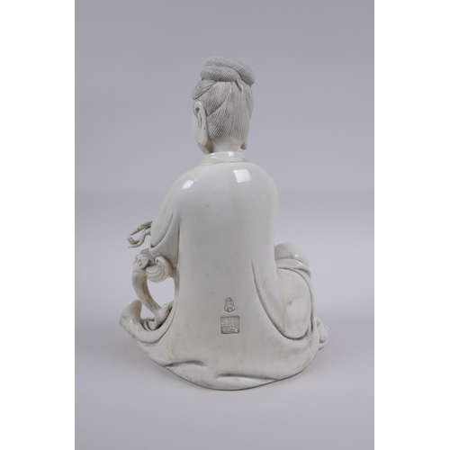 118 - A Chinese blanc de chine porcelain figure of Quan Yin, impressed seal mark to the reverse, 25cm high