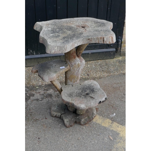 1181 - A root-wood two tier garden table, 85cm high