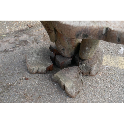 1181 - A root-wood two tier garden table, 85cm high