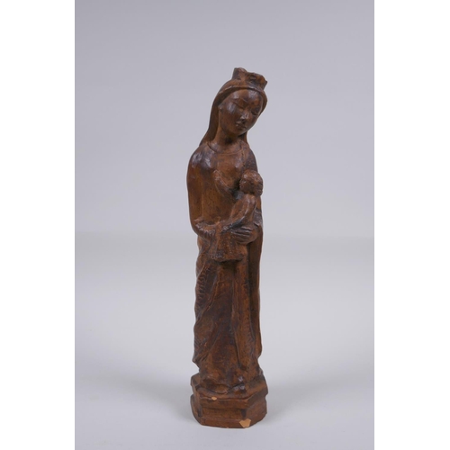 119 - A terracotta figure of Mary and Jesus, 27cm high