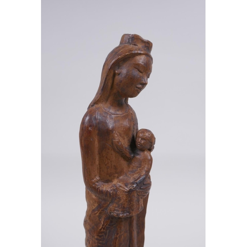 119 - A terracotta figure of Mary and Jesus, 27cm high