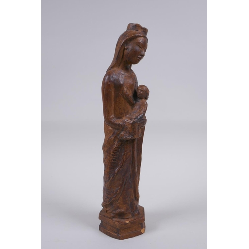 119 - A terracotta figure of Mary and Jesus, 27cm high