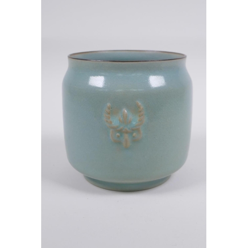 120 -  Chinese Ru ware style celadon glazed jar with twin mask decoration, 12cm high x 12cm diameter