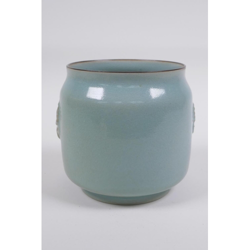 120 -  Chinese Ru ware style celadon glazed jar with twin mask decoration, 12cm high x 12cm diameter