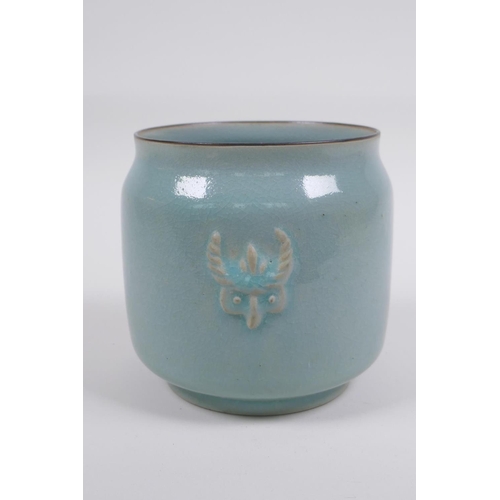 120 -  Chinese Ru ware style celadon glazed jar with twin mask decoration, 12cm high x 12cm diameter