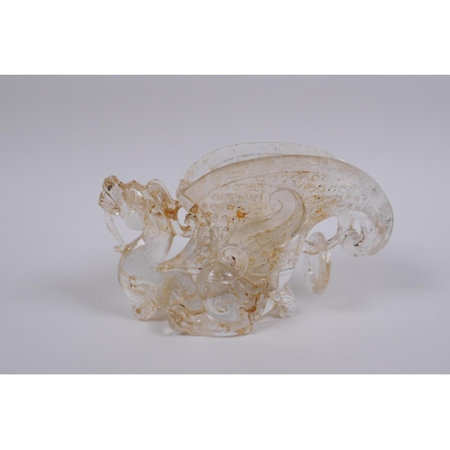 121 - A Chinese moulded glass libation cup with dragon decoration, 9cm high, 14cm long