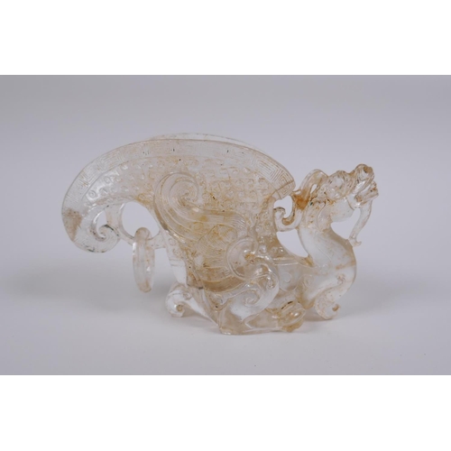 121 - A Chinese moulded glass libation cup with dragon decoration, 9cm high, 14cm long