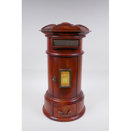 122 - A cylinder fruitwood table post box with brass letter slot and single drawer, 42cm high