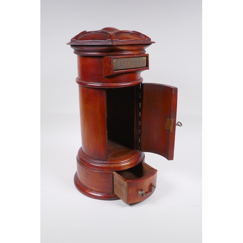 122 - A cylinder fruitwood table post box with brass letter slot and single drawer, 42cm high