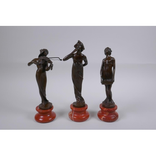 124 - Three Art Nouveau style bronzes of women, 22cm highest