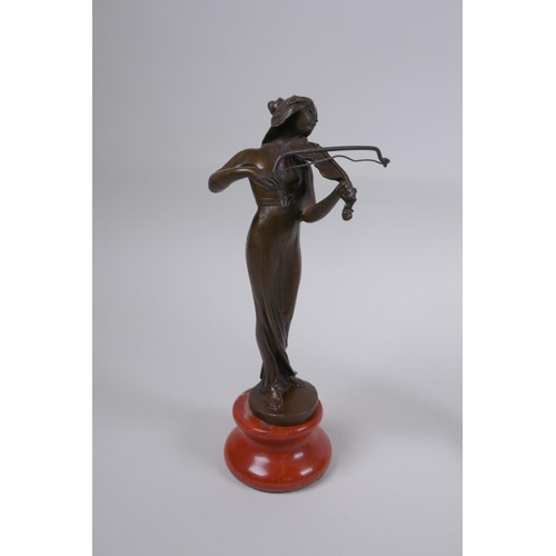 124 - Three Art Nouveau style bronzes of women, 22cm highest