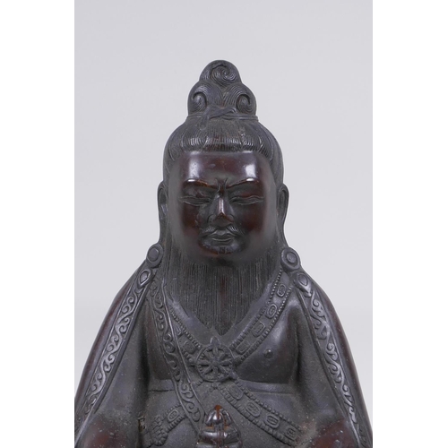 126 - A Sino Tibetan bronze figure of a bearded deity seated in meditation, 29cm high