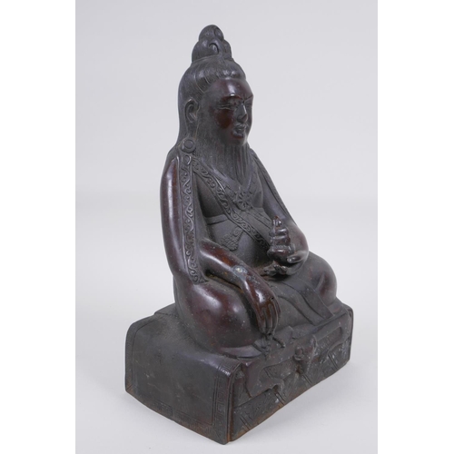 126 - A Sino Tibetan bronze figure of a bearded deity seated in meditation, 29cm high