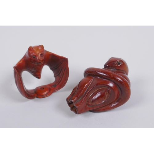 128 - Two Japanese carved boxwood netsuke in the form of a snake and a bat, signed, 5cm long