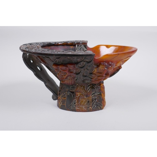 140 - A Chinese sectional horn libation cup with carved decoration of figures in a landscape, 19 x 15cm, 1... 